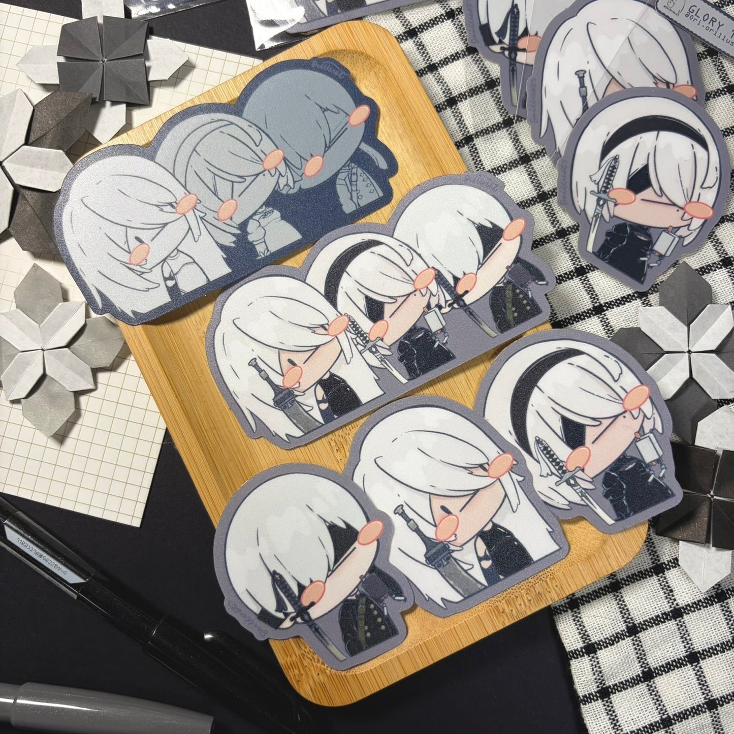 Set of stickers with an anime character on a checkered surface